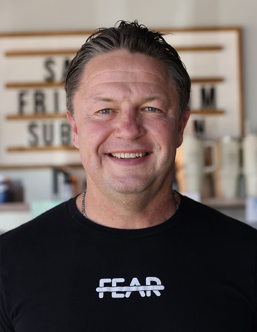 Dr. Hooten in a black t-shirt with the crossed-out word FEAR on the chest